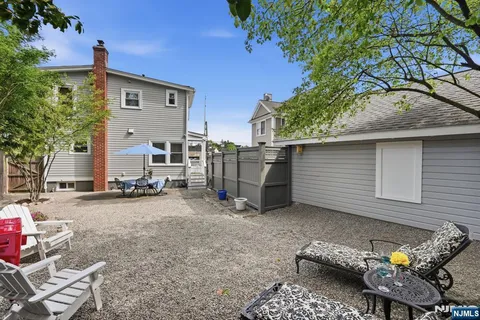 a backyard of a house with seating space