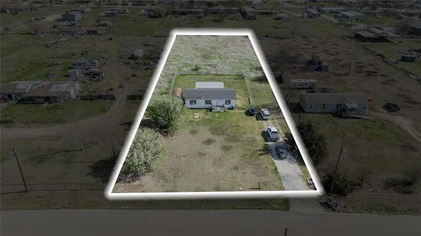 a aerial view of a house with a yard