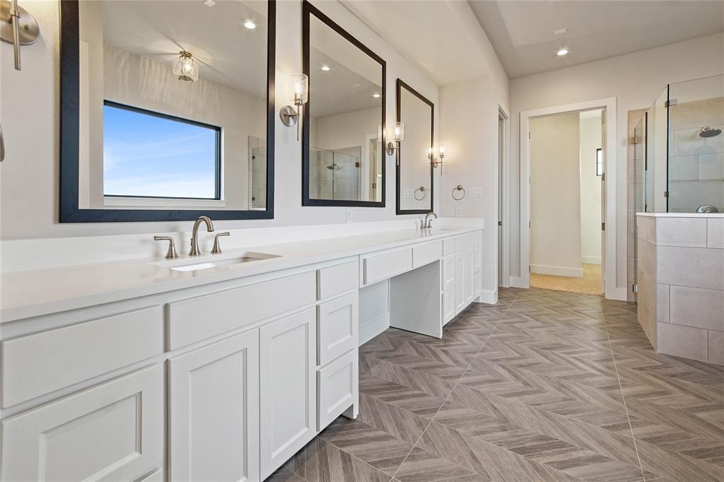 2108 Sicily Lane Haslet, TX 76052 - Photo 16 of 17 a spacious bathroom with a double vanity sink a mirror and a shower