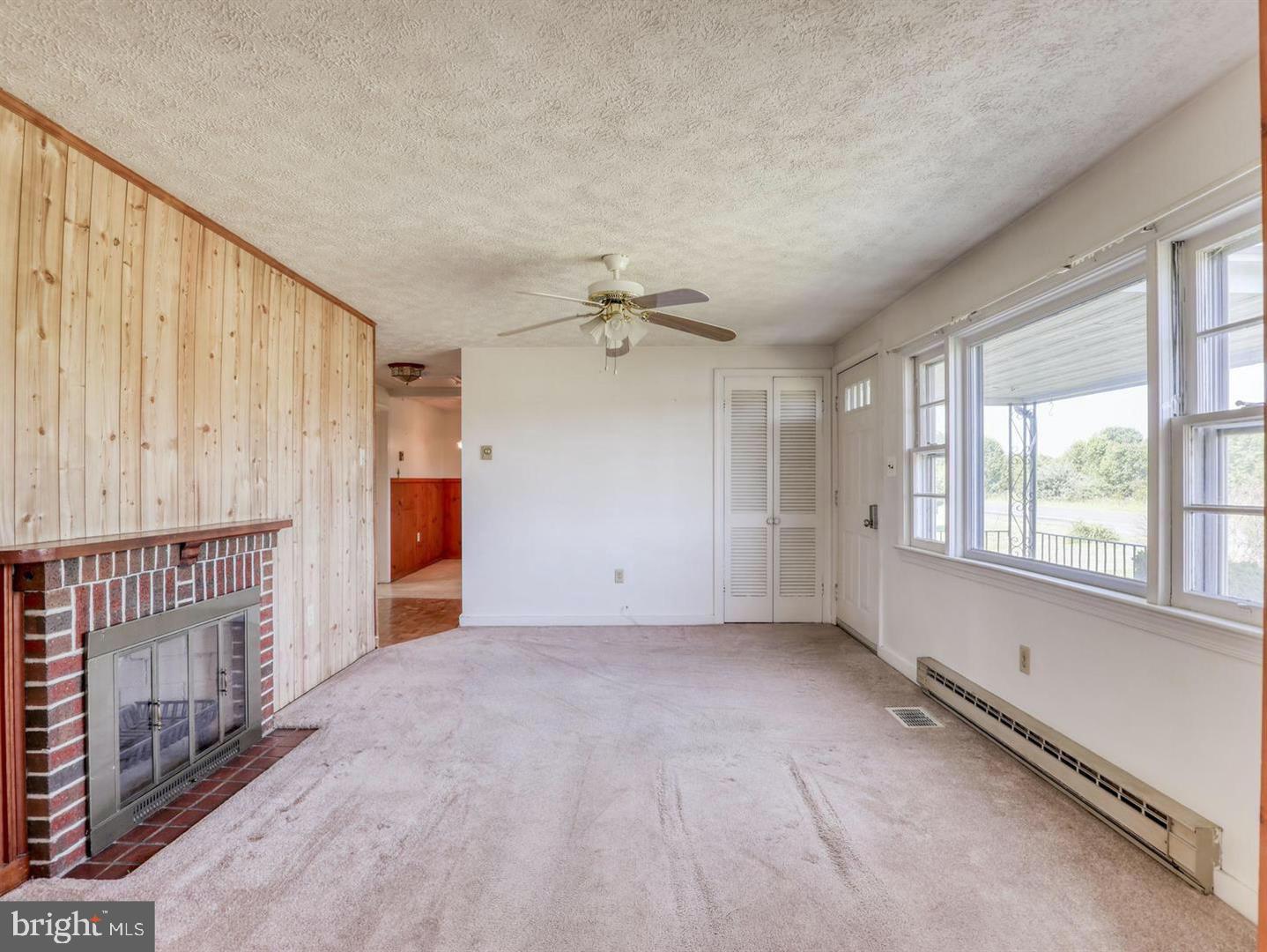 234 Gun Club Road Stephenson, VA 22656 - Photo 12 of 28 Living Room has Fireplace and new flooring