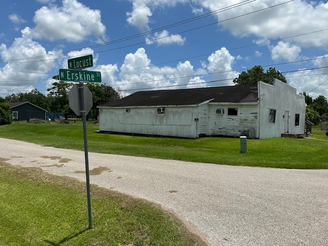 326 North Erskine Street Angleton, TX 77515 - Photo 2 of 10 a view of a house with a big yard and large tree