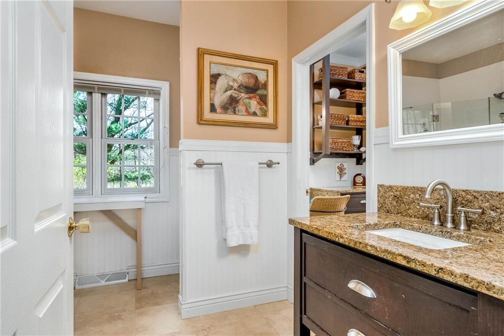 2430 Brandt School Road Wexford, PA 15090 - Photo 11 of 25 a bathroom with a granite countertop sink a mirror and a shower
