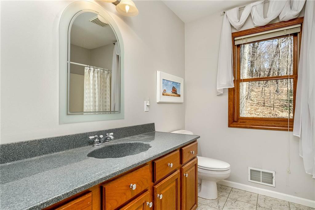 2430 Brandt School Road Wexford, PA 15090 - Photo 14 of 25 a bathroom with a sink double vanity and a toilet