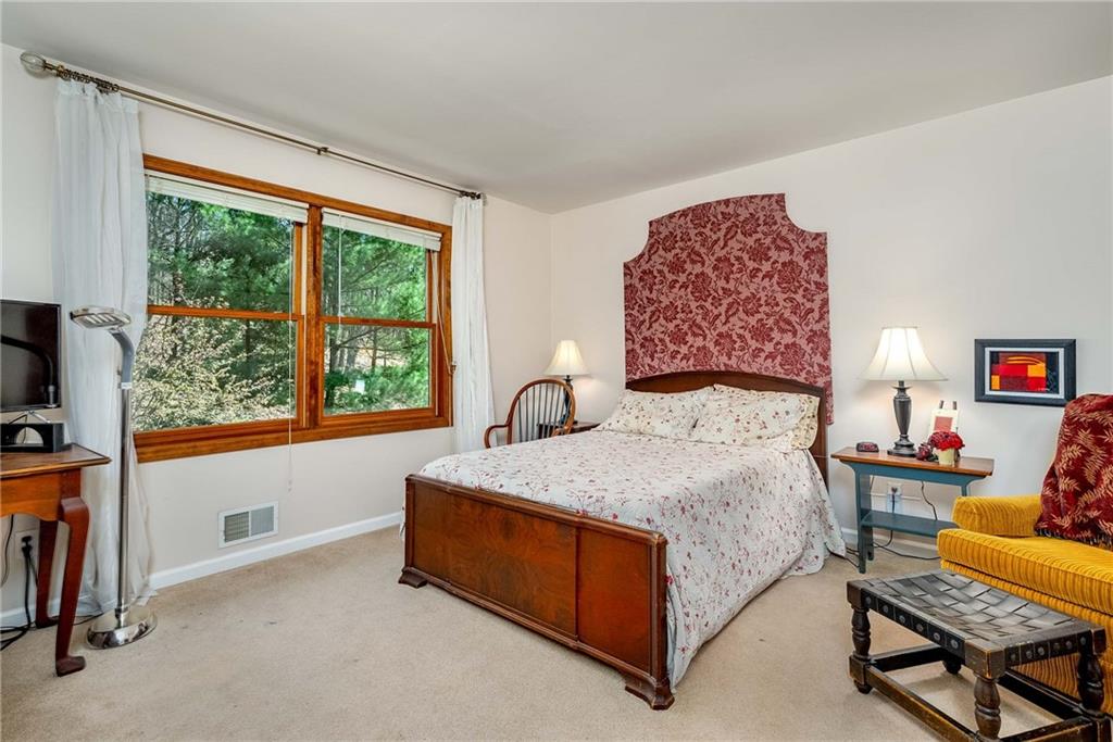 2430 Brandt School Road Wexford, PA 15090 - Photo 15 of 25 a bed sitting in a bedroom next to a window