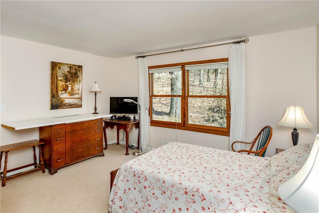 2430 Brandt School Road Wexford, PA 15090 - Photo 16 of 25 a bedroom with a bed and a flat screen tv