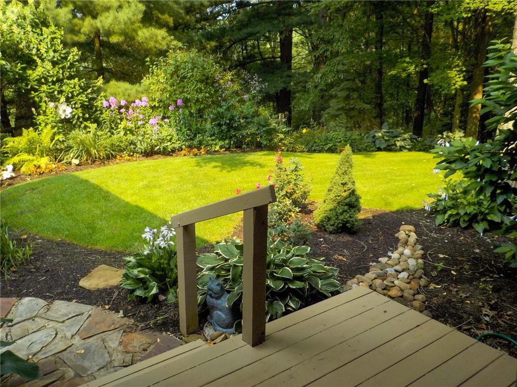 2430 Brandt School Road Wexford, PA 15090 - Photo 21 of 25 a view of a swimming pool with an outdoor space and seating area