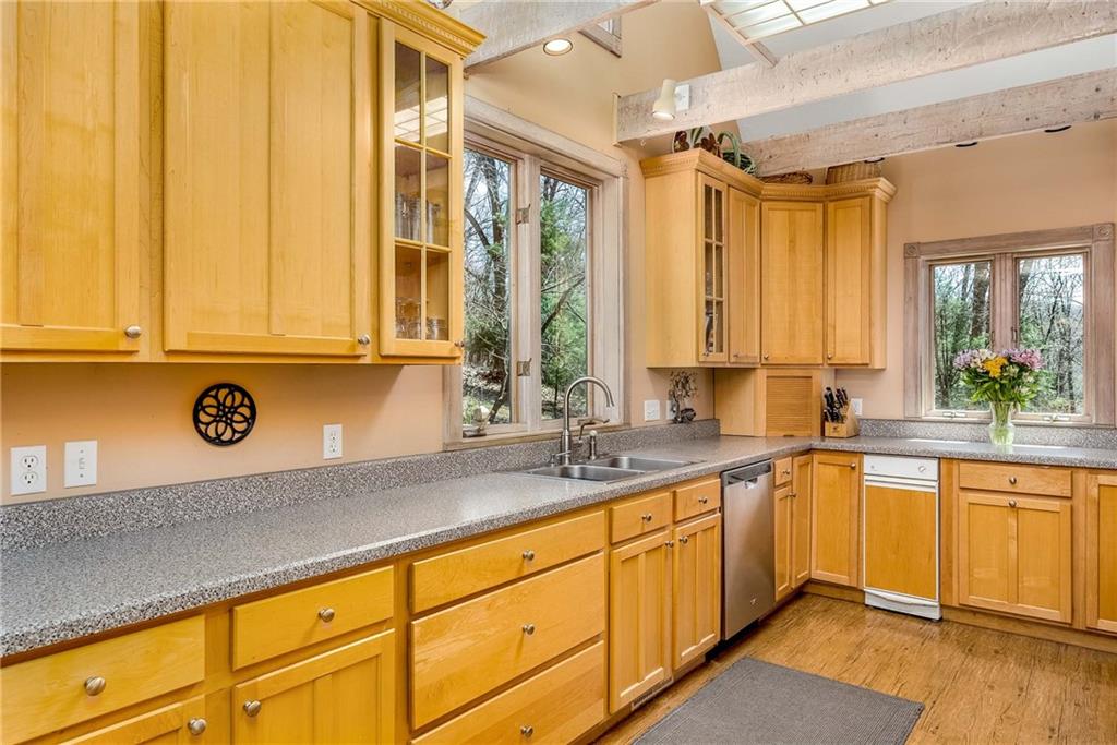 2430 Brandt School Road Wexford, PA 15090 - Photo 7 of 25 a kitchen with a sink a counter top space and cabinets