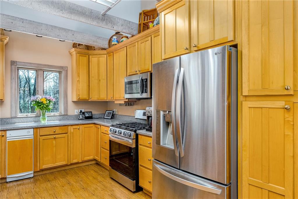 2430 Brandt School Road Wexford, PA 15090 - Photo 9 of 25 a kitchen with a refrigerator a sink and cabinets