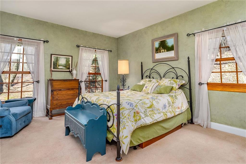 2430 Brandt School Road Wexford, PA 15090 - Photo 10 of 25 a bedroom with a bed and wooden floor