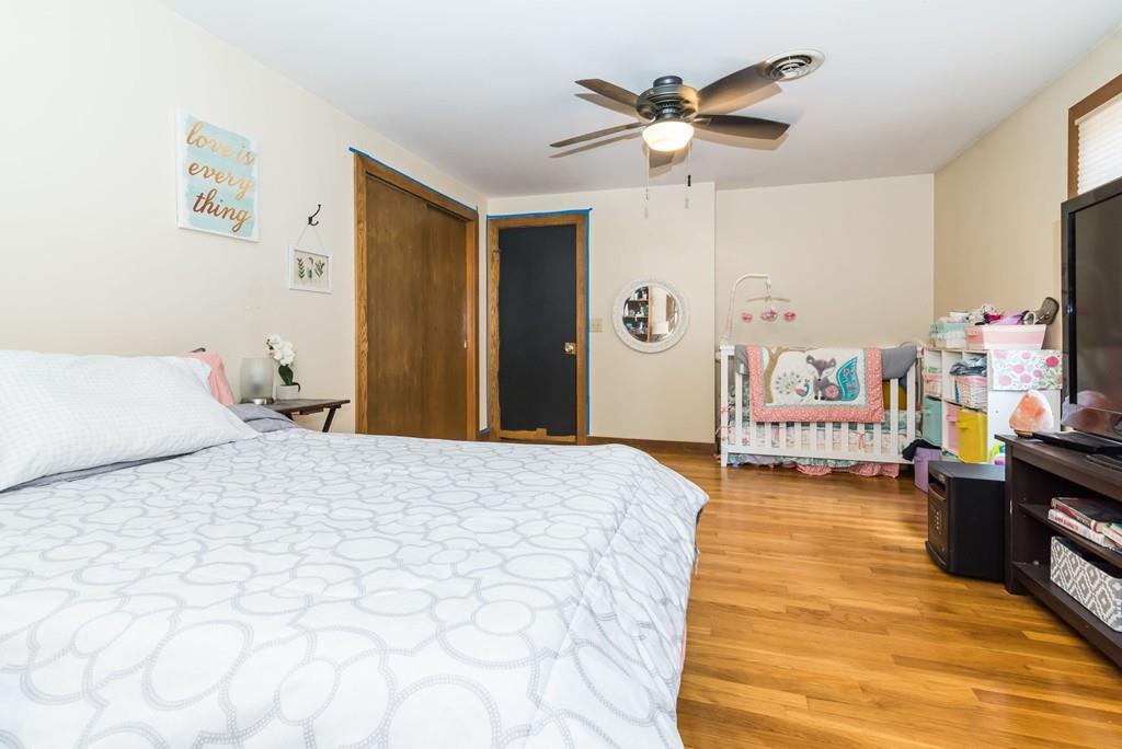 28 Damon Road Ashby, MA 01431 - Photo 23 of 34 a bedroom with a bed and a chandelier