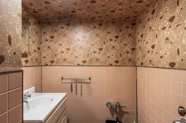 a bathroom with a sink and mirror