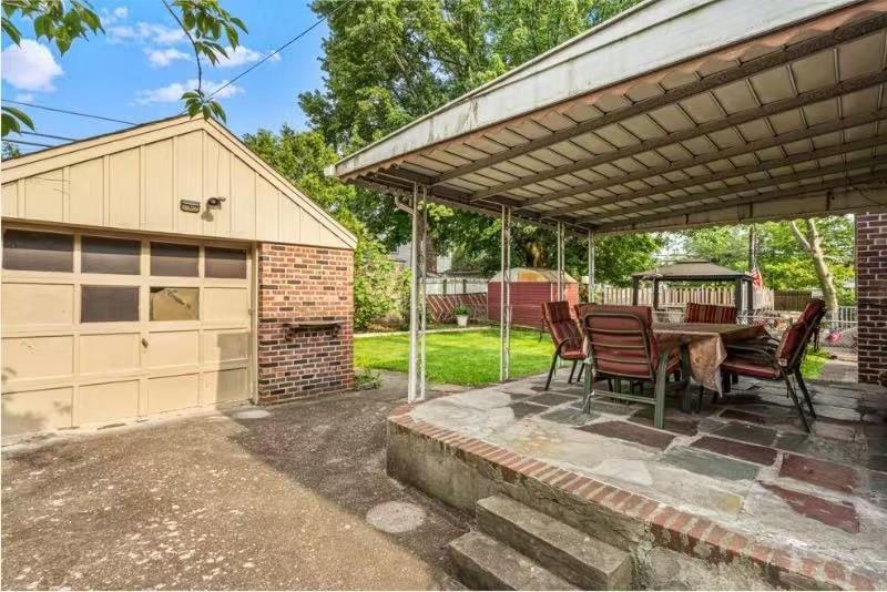 49-75 175th Place Queens, NY 11365 - Photo 2 of 21 a view of a backyard with a sitting area