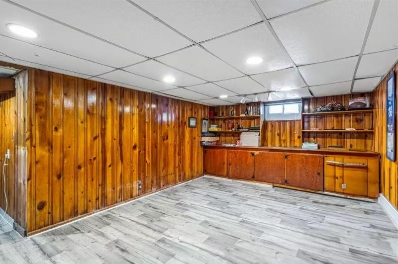 49-75 175th Place Queens, NY 11365 - Photo 21 of 21 a view of empty room with wooden walls