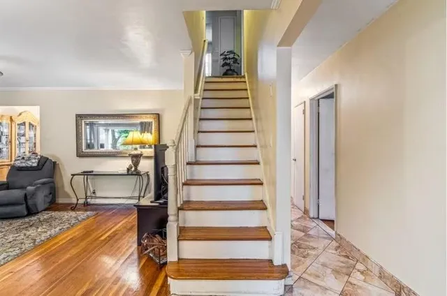 a view of a living room and entryway