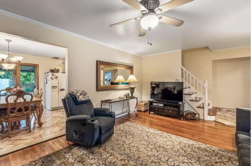 49-75 175th Place Queens, NY 11365 - Photo 5 of 21 a living room with furniture and a flat screen tv