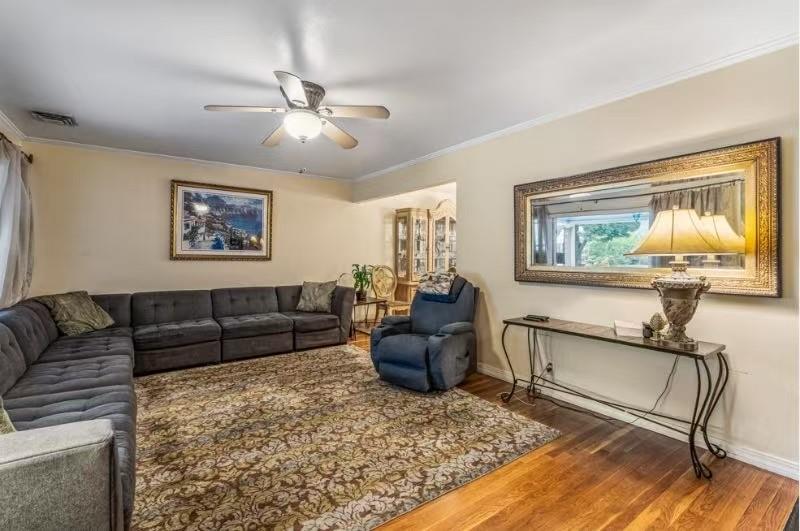 49-75 175th Place Queens, NY 11365 - Photo 6 of 21 a living room with furniture and a window