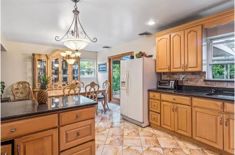 49-75 175th Place Queens, NY 11365 - Photo 9 of 21 a kitchen with sink refrigerator and window