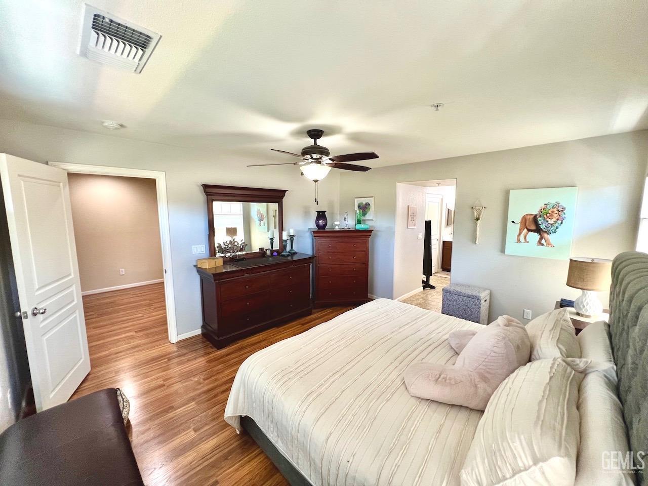 Undisclosed Address Atascadero, CA 93422 - Photo 18 of 30 a bedroom with a bed and a chandelier