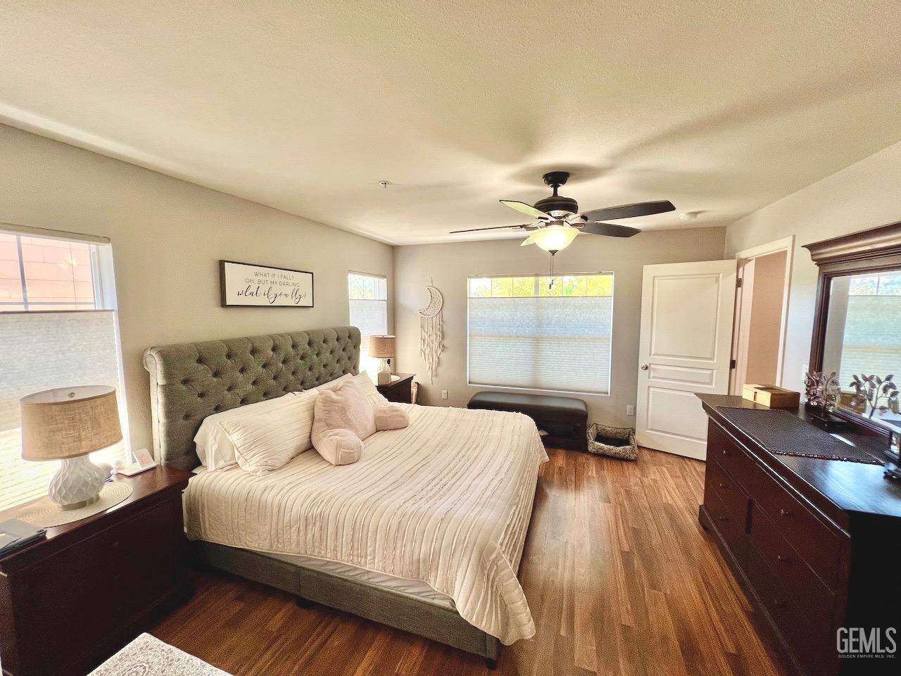 Undisclosed Address Atascadero, CA 93422 - Photo 19 of 30 a bedroom with a bed and a chandelier