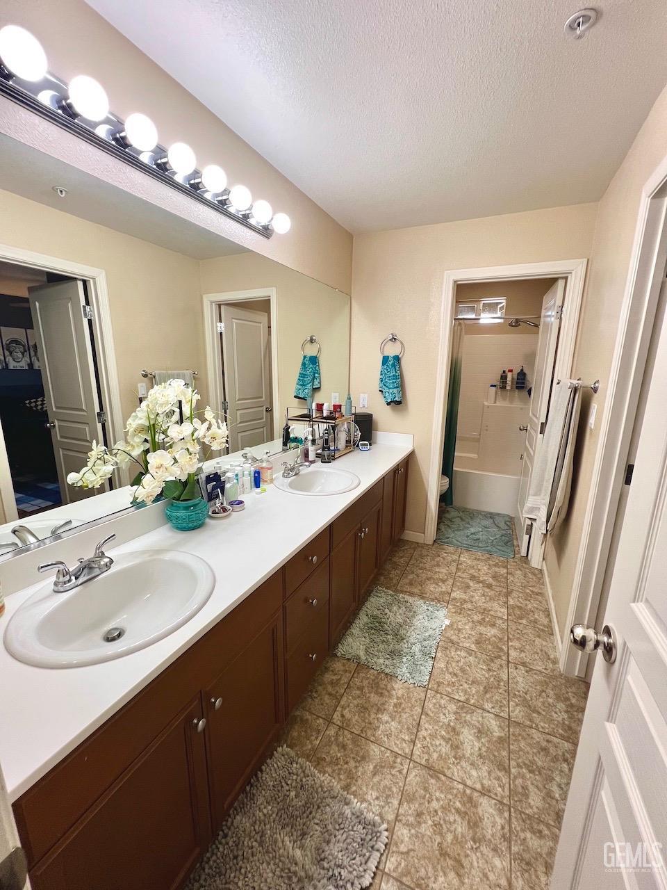 Undisclosed Address Atascadero, CA 93422 - Photo 21 of 30 a bathroom with a sink double vanity granite and a mirror