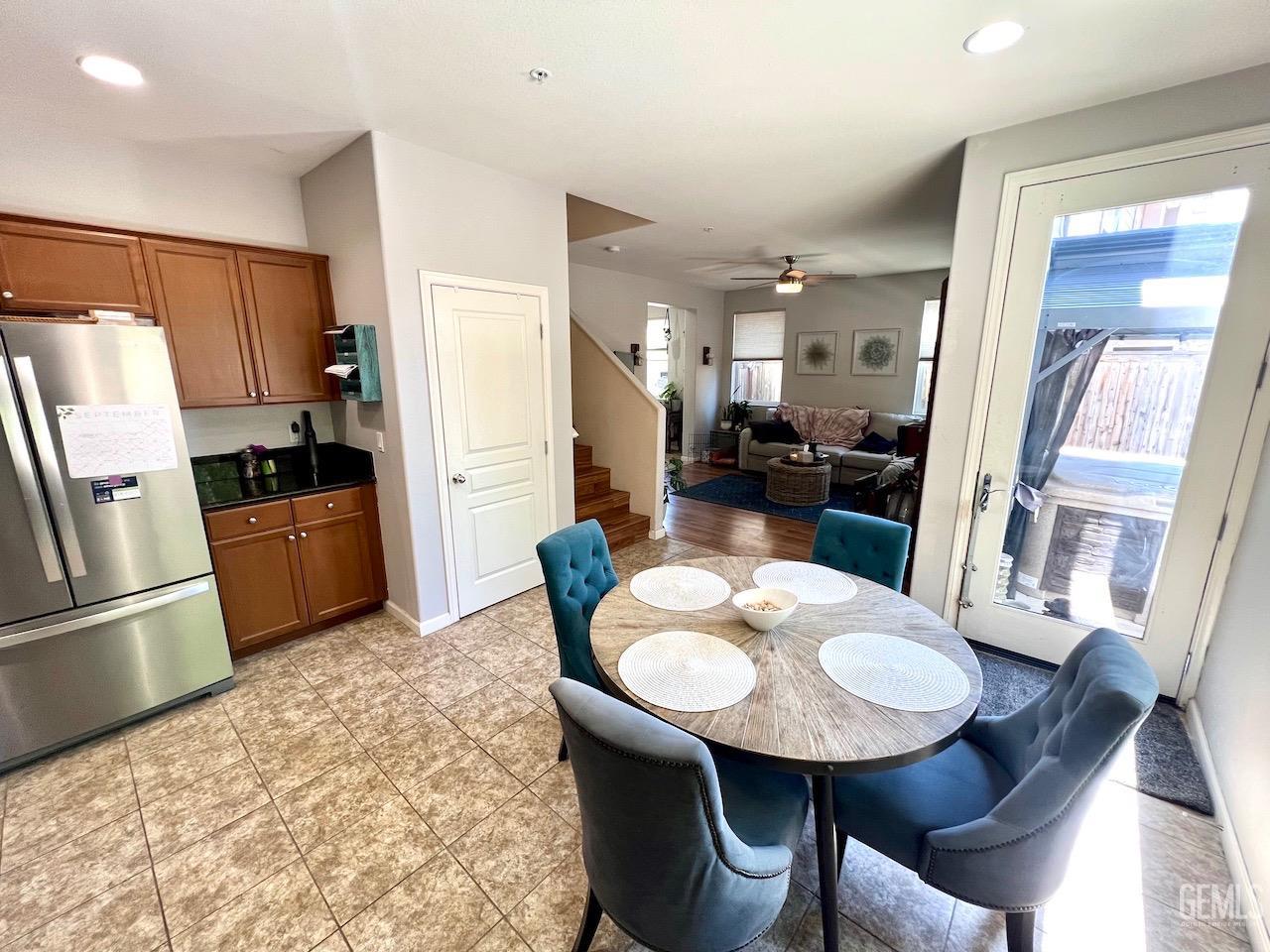 Undisclosed Address Atascadero, CA 93422 - Photo 8 of 30 a kitchen with a table chairs and refrigerator