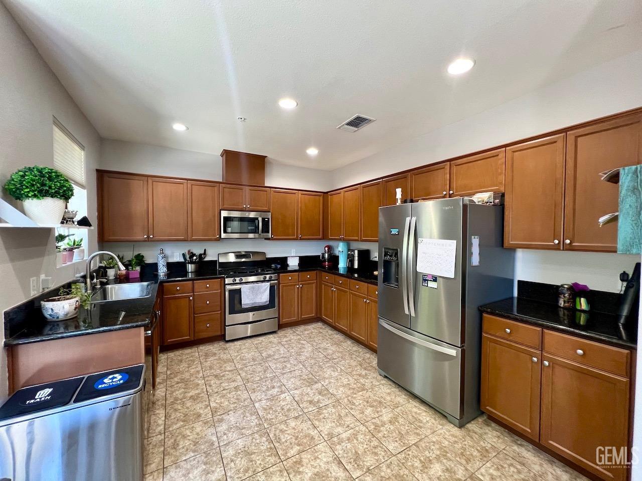 Undisclosed Address Atascadero, CA 93422 - Photo 9 of 30 a kitchen with stainless steel appliances granite countertop a refrigerator stove top oven and sink