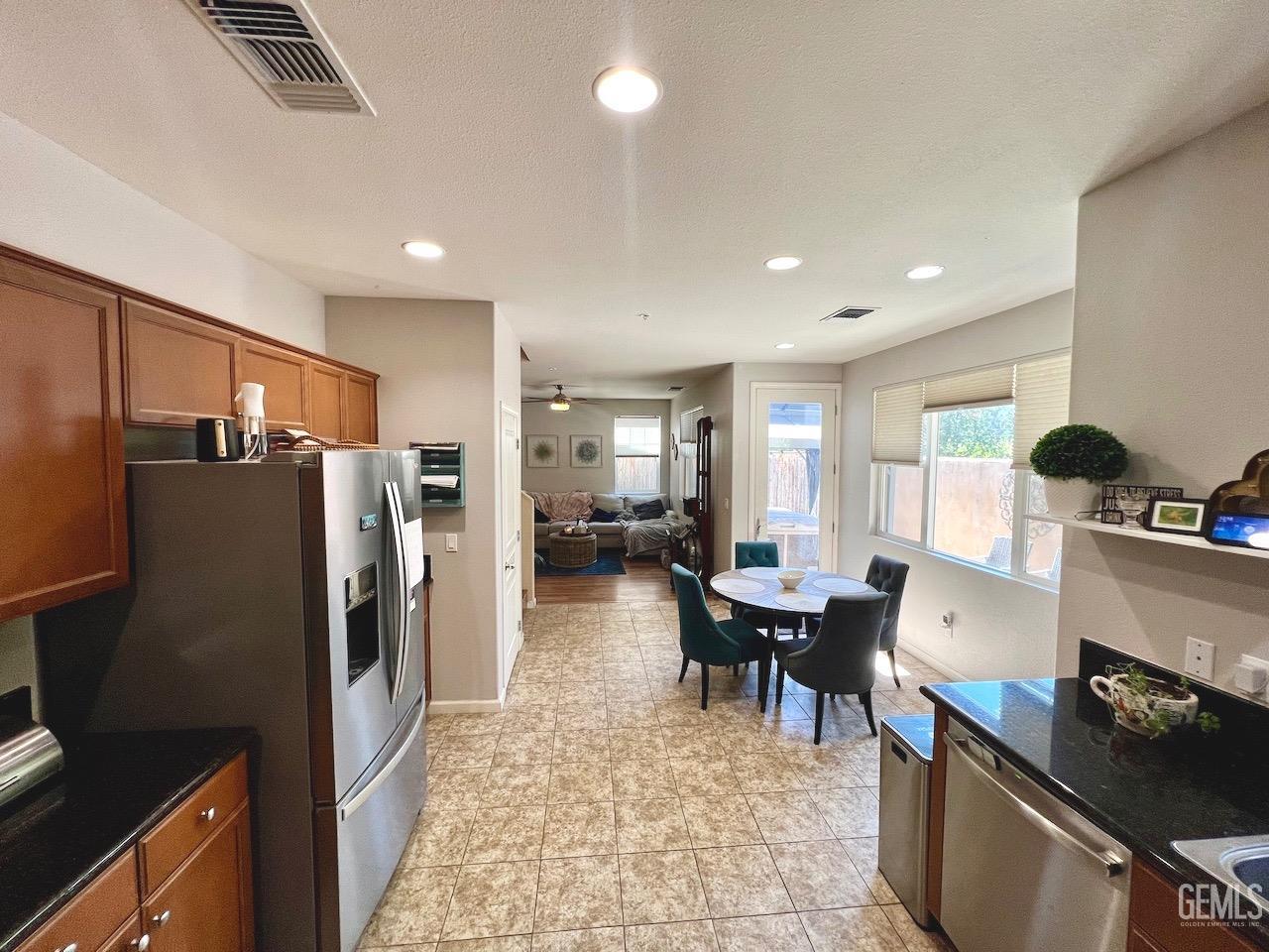 Undisclosed Address Atascadero, CA 93422 - Photo 10 of 30 a kitchen with sink refrigerator and dining table