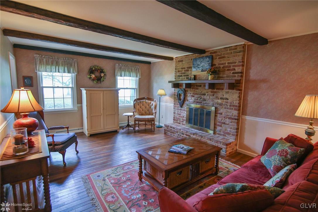 3305 Altonah Road Bethlehem, PA 18017 - Photo 3 of 26 Dark hardwood floors, beamed ceiling and wood burn
