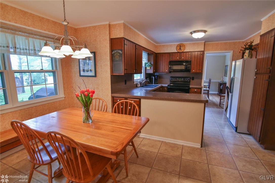 3305 Altonah Road Bethlehem, PA 18017 - Photo 8 of 26 A nicely-sized eat-in kitchen with views to the ba