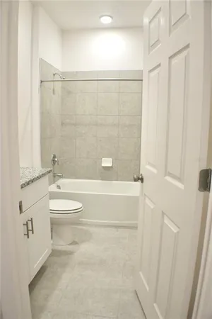 a bathroom with a toilet and shower