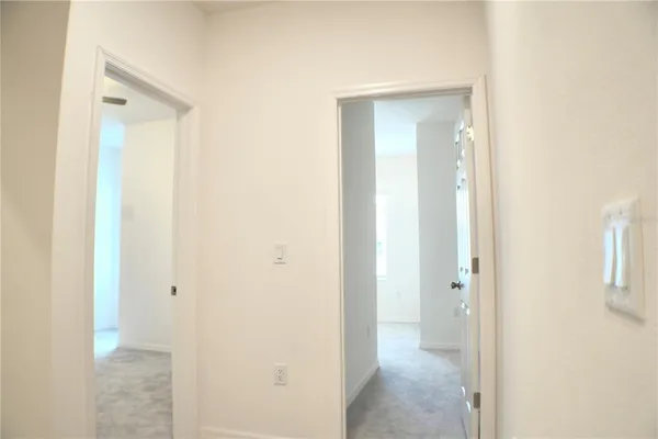 a view of a bathroom from a hallway