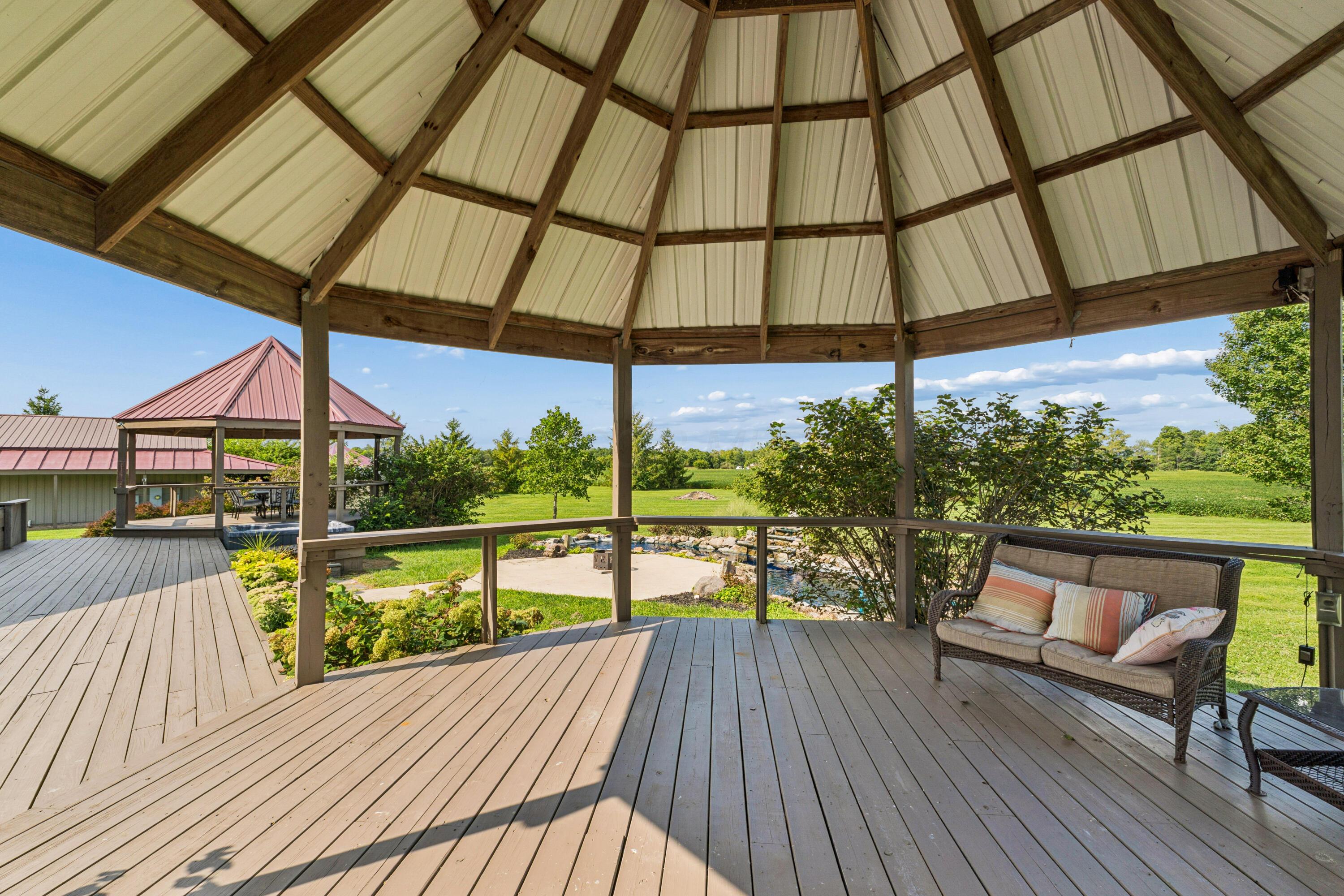 18964 London Road Circleville, OH 43113 - Photo 18 of 57 Octagonal gazebo with a metal roof and wood-finish decking