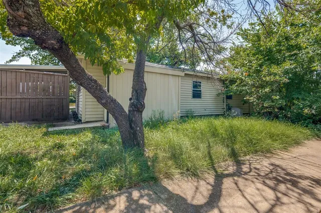 a backyard of a house with lots of green space