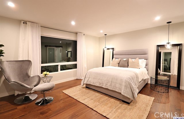 770 Panorama Place Pasadena, CA 91105 - Photo 12 of 35 a bedroom with a bed and windows