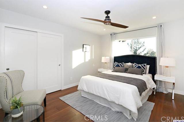 770 Panorama Place Pasadena, CA 91105 - Photo 16 of 35 a bedroom with a large bed and a potted plant