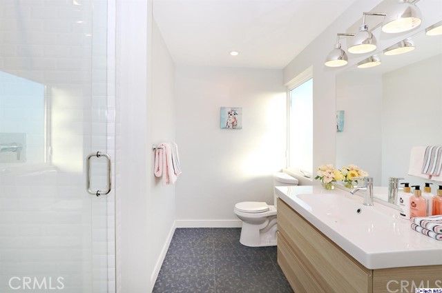 770 Panorama Place Pasadena, CA 91105 - Photo 18 of 35 a bathroom with a double vanity sink mirror and toilet