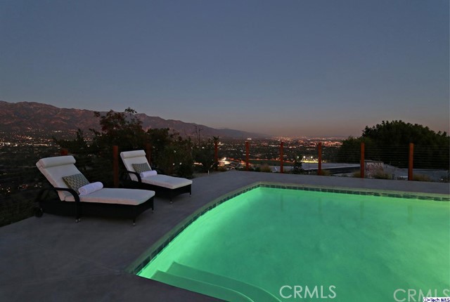 770 Panorama Place Pasadena, CA 91105 - Photo 32 of 35 a view of a swimming pool with lawn chairs