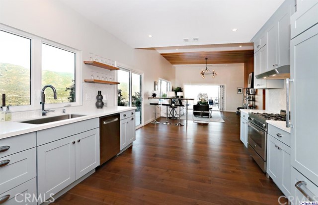 770 Panorama Place Pasadena, CA 91105 - Photo 8 of 35 a large kitchen with stainless steel appliances a lot of counter space and a wooden floors
