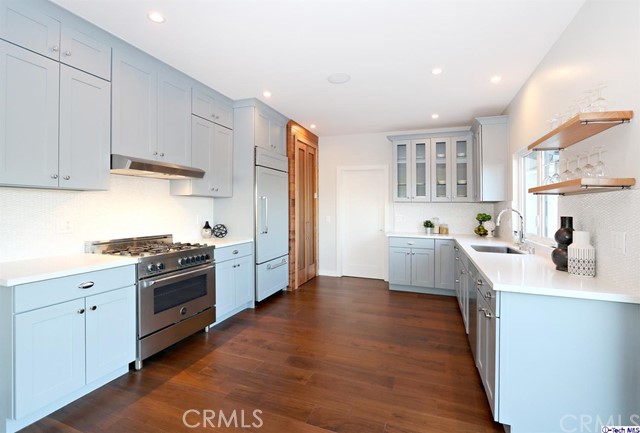770 Panorama Place Pasadena, CA 91105 - Photo 9 of 35 a kitchen with granite countertop a sink cabinets stainless steel appliances and a window