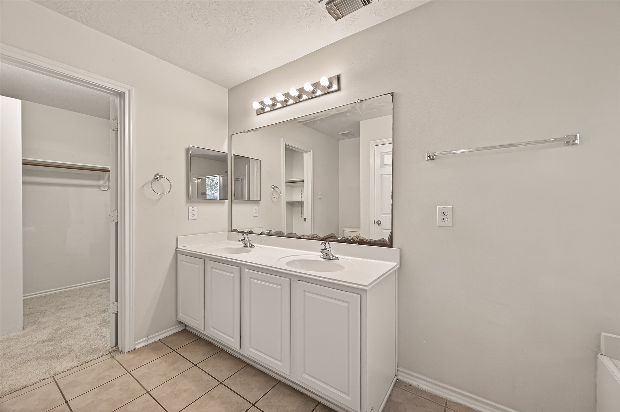 210 Drake Run Lane Dickinson, TX 77539 - Photo 13 of 20 a spacious bathroom with a mirror a sink and a mirror