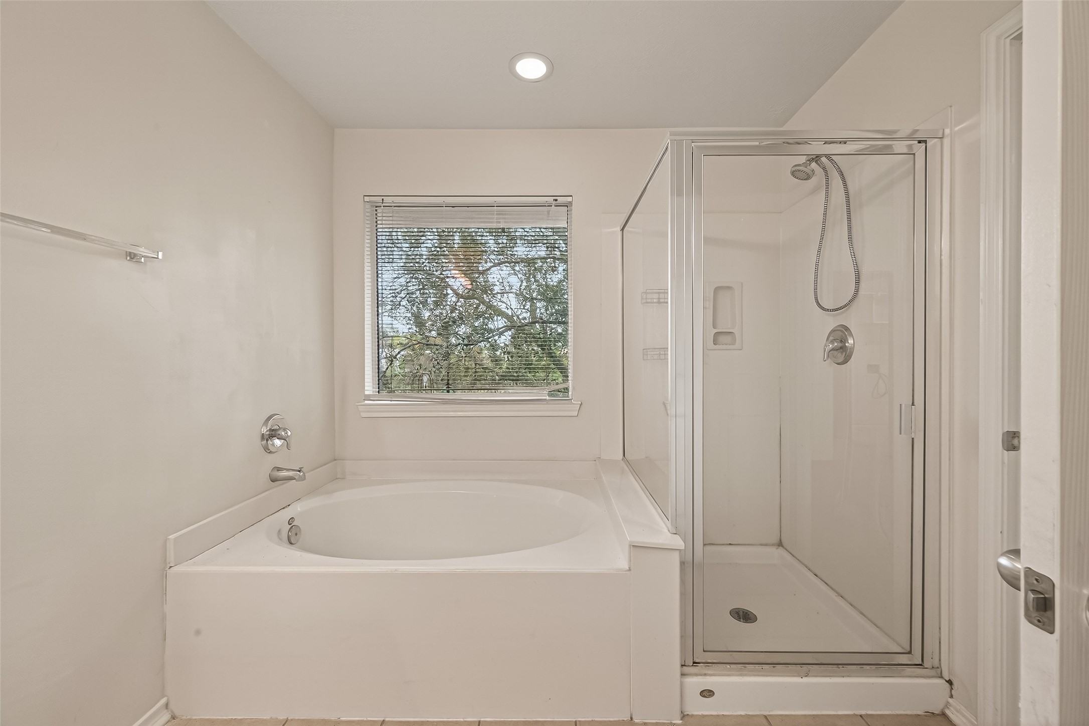 210 Drake Run Lane Dickinson, TX 77539 - Photo 14 of 20 a bathroom with a tub shower vanity and a sink