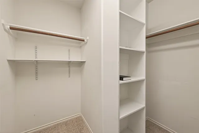 a view of an empty walk in closet