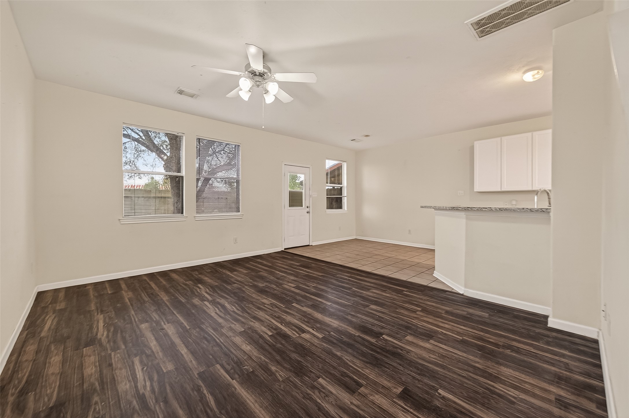 210 Drake Run Lane Dickinson, TX 77539 - Photo 3 of 20 a view of empty room with wooden floor and fan
