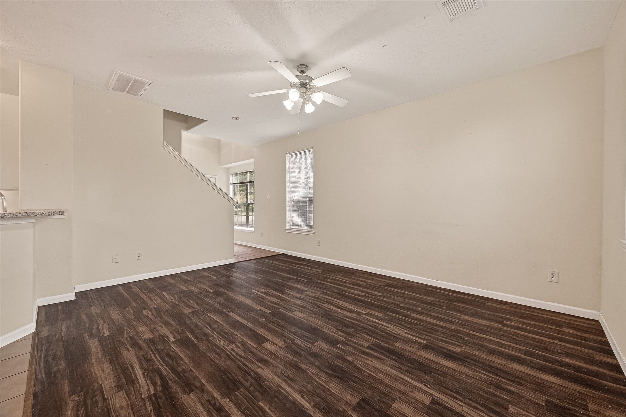 210 Drake Run Lane Dickinson, TX 77539 - Photo 4 of 20 wooden floor in an empty room with a window