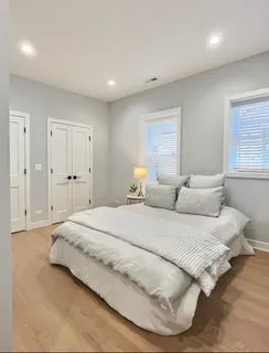 a bathroom with a double vanity sink toilet and shower