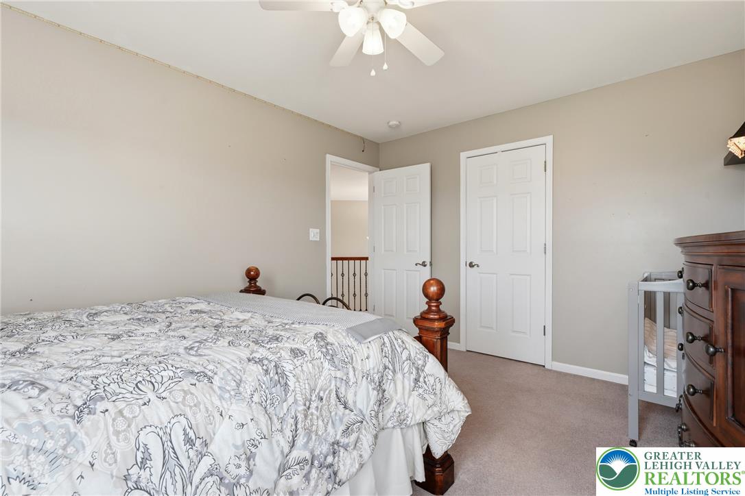 245 East Dell Road Bath, PA 18014 - Photo 46 of 99 A comforting retreat featuring a ceiling fan and plush carpeted flooring, creating a serene personal space.