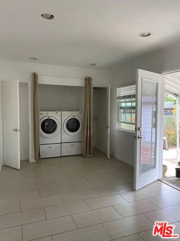 a utility room with washer and dryer