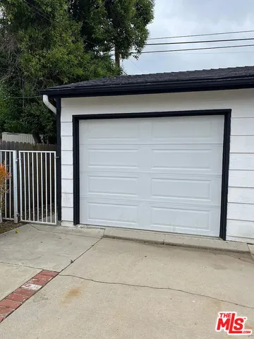 a side view of a house with a garage