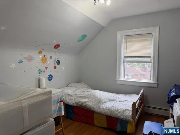 a bedroom with a bed and a table in it