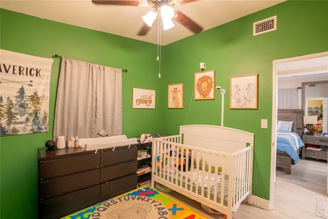 a bedroom with a bed and a dresser